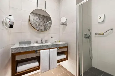 a bathroom with a sink and a shower at Tryp by Wyndham Istanbul Topkapi in Istanbul