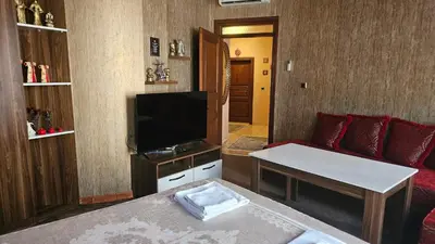 a living room with a couch and a flat screen tv at The Pashas House in Istanbul