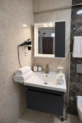 a bathroom with a sink and a mirror at Galaxy Hotel Sultanahmet in Istanbul