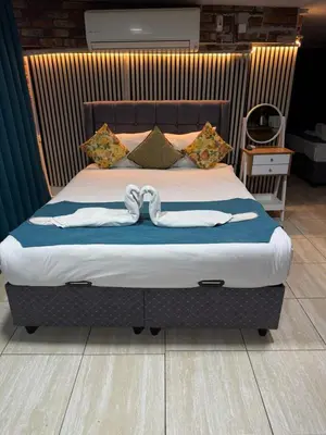 a bed with two white towels on top of it at Galaxy Hotel Sultanahmet in Istanbul