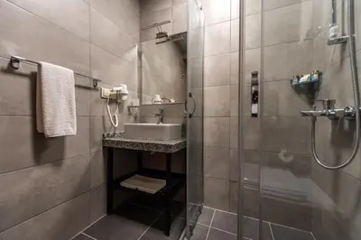 a bathroom with a sink and a shower at Bram Hotel Istanbul in Istanbul