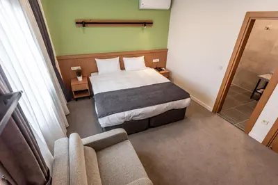 a hotel room with a bed and a couch at Bram Hotel Istanbul in Istanbul