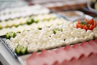 a tray of food with tomatoes and other foods at New Florenta Hotel in Istanbul