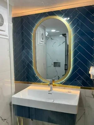 a bathroom with a sink and a mirror at New Florenta Hotel in Istanbul