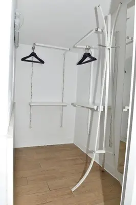 a room with three hangers and a white wall at Levent Lavandula Hotel in Istanbul
