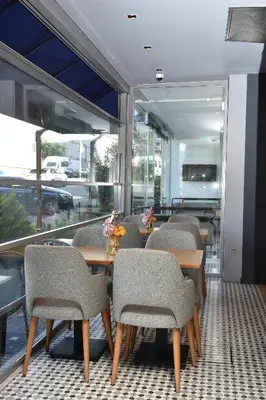 a row of tables and chairs in a restaurant at Levent Lavandula Hotel in Istanbul