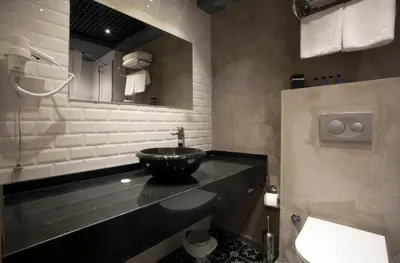 a bathroom with a sink and a mirror at Red Stone Hotel in Istanbul
