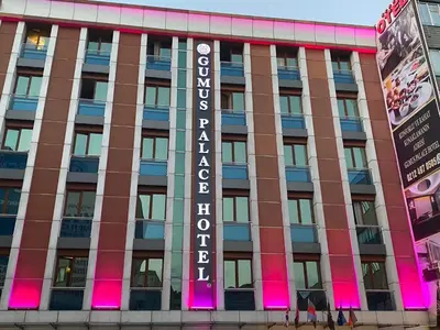 a building with a sign on the side of it at Gumus Palace Hotel in Istanbul
