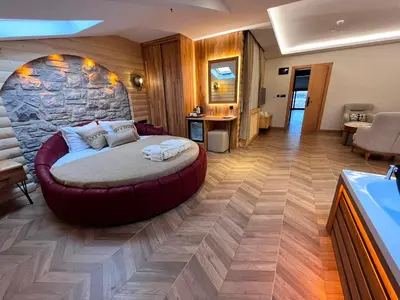 a bedroom with a large bed in a room at Gumus Palace Hotel in Istanbul