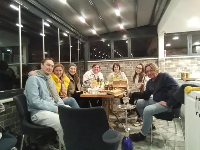 a group of people sitting at a table in a restaurant at City Hall Hotel Sultanahmet in Istanbul