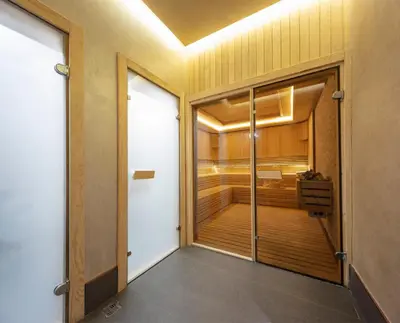 a room with a walk in shower and a door at Danis Hotel & Spa Istanbul - Old City in Istanbul