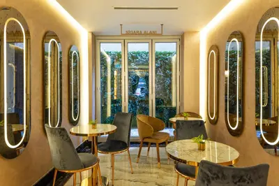 a restaurant with tables and chairs and a window at Danis Hotel & Spa Istanbul - Old City in Istanbul