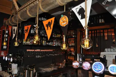 a bar with halloween signs on the wall at Barkod Otel in Istanbul