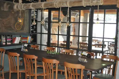 a dining room with a table and chairs at Barkod Otel in Istanbul