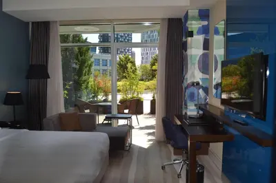 a hotel room with a bed and a large window at Wyndham Grand Istanbul Europe in Istanbul