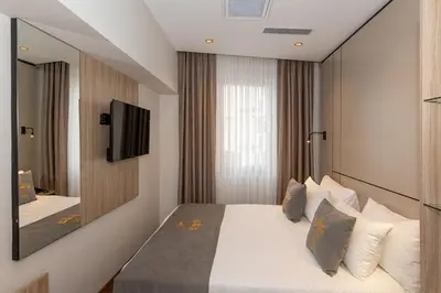 a hotel room with a bed and a mirror at Yez Boutique Hotel in Istanbul