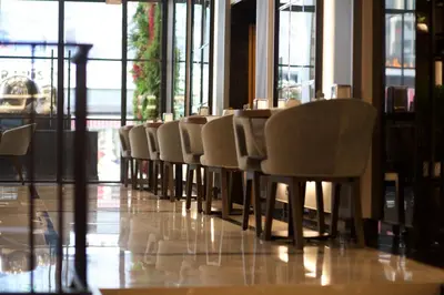 a row of chairs sitting at a table in a restaurant at SORRISO HOTEL DUE in Istanbul