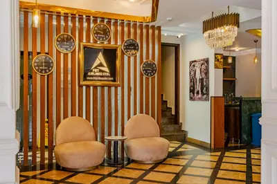 a lobby with two chairs and a striped wall at Frt Airlines Hotel - Istanbul Airport in Arnavutköy