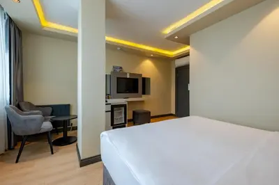 a hotel room with a bed and a tv at Frt Airlines Hotel - Istanbul Airport in Arnavutköy