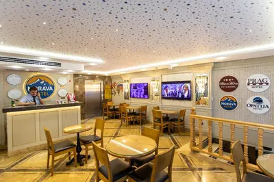 a restaurant with tables and chairs and a bar at Morava Hotel in Istanbul