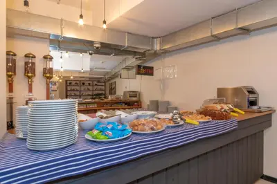 a table with plates of food on a counter in a kitchen at Rumours Inn in Istanbul