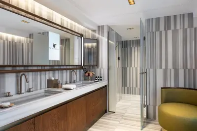 a bathroom with two sinks and a shower at JW Marriott Istanbul Bosphorus in Istanbul