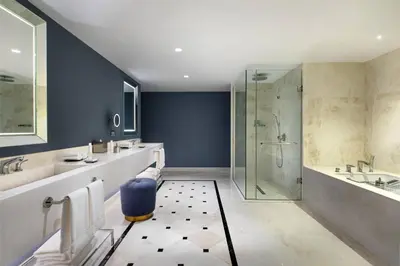 a bathroom with a shower and a sink and a tub at JW Marriott Istanbul Bosphorus in Istanbul