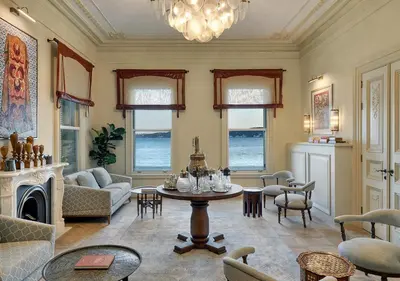 a living room with a table and chairs at Kocatas Mansions in Istanbul