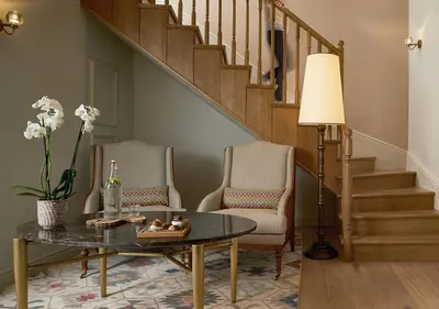 a living room with two chairs and a table at Kocatas Mansions in Istanbul