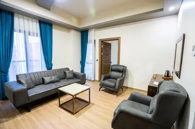 a living room with a couch and two chairs at Mugwort Hotel & Spa in Istanbul