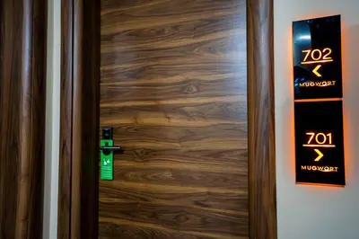 a wooden door with a sign on it at Mugwort Hotel & Spa in Istanbul