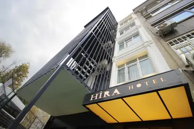 a hotel sign in front of a building at Hira Hotel in Istanbul