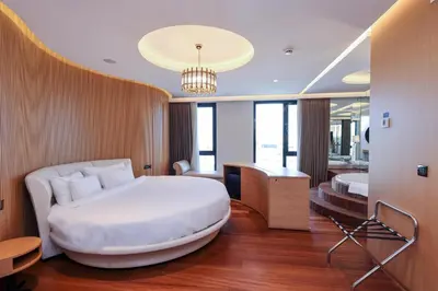 a hotel room with a large bed and a desk at Radisson Blu Hotel, Sakarya in Sakarya