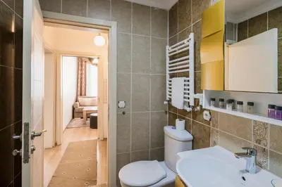 a bathroom with a toilet and a sink at Punto Suite in Istanbul