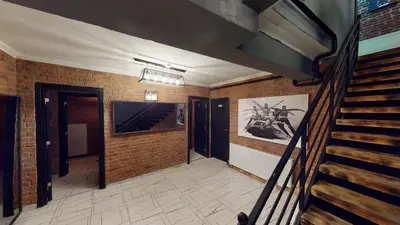 a hallway with a staircase and a brick wall at The Wolf Hotel in Istanbul