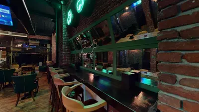 a bar in a restaurant with a brick wall at The Wolf Hotel in Istanbul
