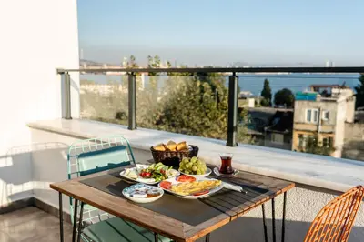 a tray of food on a table on a balcony at The Camelot Hotel in Istanbul