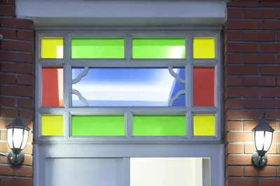 a colorful window on a brick wall with a door at Pi Art Butik Otel in Istanbul