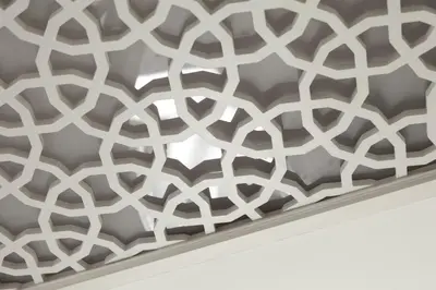 a metal wall with a laser cut pattern on it at Pi Art Butik Otel in Istanbul