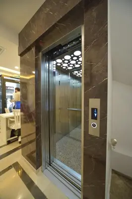 a lobby with a glass door with a mirror at Lika Hotel in Istanbul