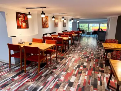 a dining room with wooden tables and chairs at Comfort Downtown Istanbul Hotel in Istanbul