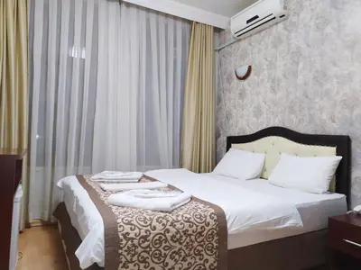 a hotel room with a bed with towels on it at Taxim Hotel Marin in Istanbul