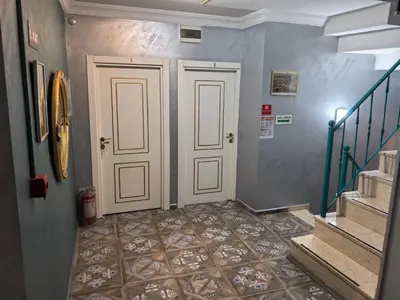 a hallway with two doors and a tile floor at Old City Pansiyon in Istanbul