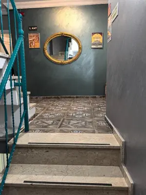 a stairwell with a circular mirror and a stairway with a stairwayngth at Old City Pansiyon in Istanbul