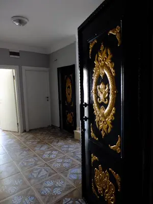 an open door in a room with a tile floor at Old City Pansiyon in Istanbul