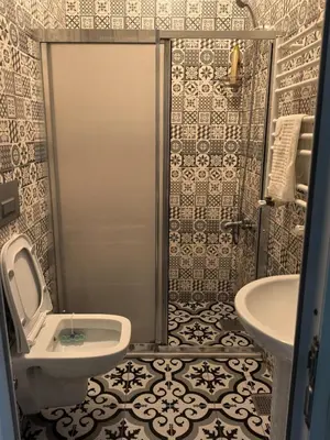 a bathroom with a toilet and a sink at Old City Pansiyon in Istanbul