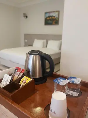 a tea kettle on a table in a living room at Marina Park Hotel in Istanbul