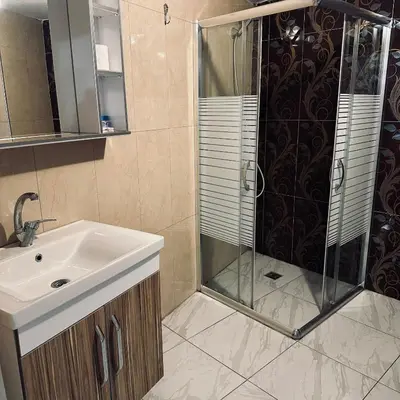 a bathroom with a shower and a sink at Bursa Malkoc Hotel in Bursa