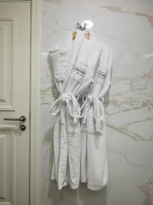 a group of white towels hanging on a wall at Azzap Hotel Galata in Istanbul