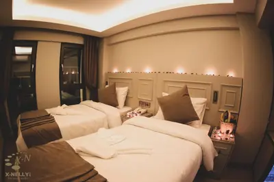 a group of three beds in a room at X-NELLYİ HOTEL in Istanbul